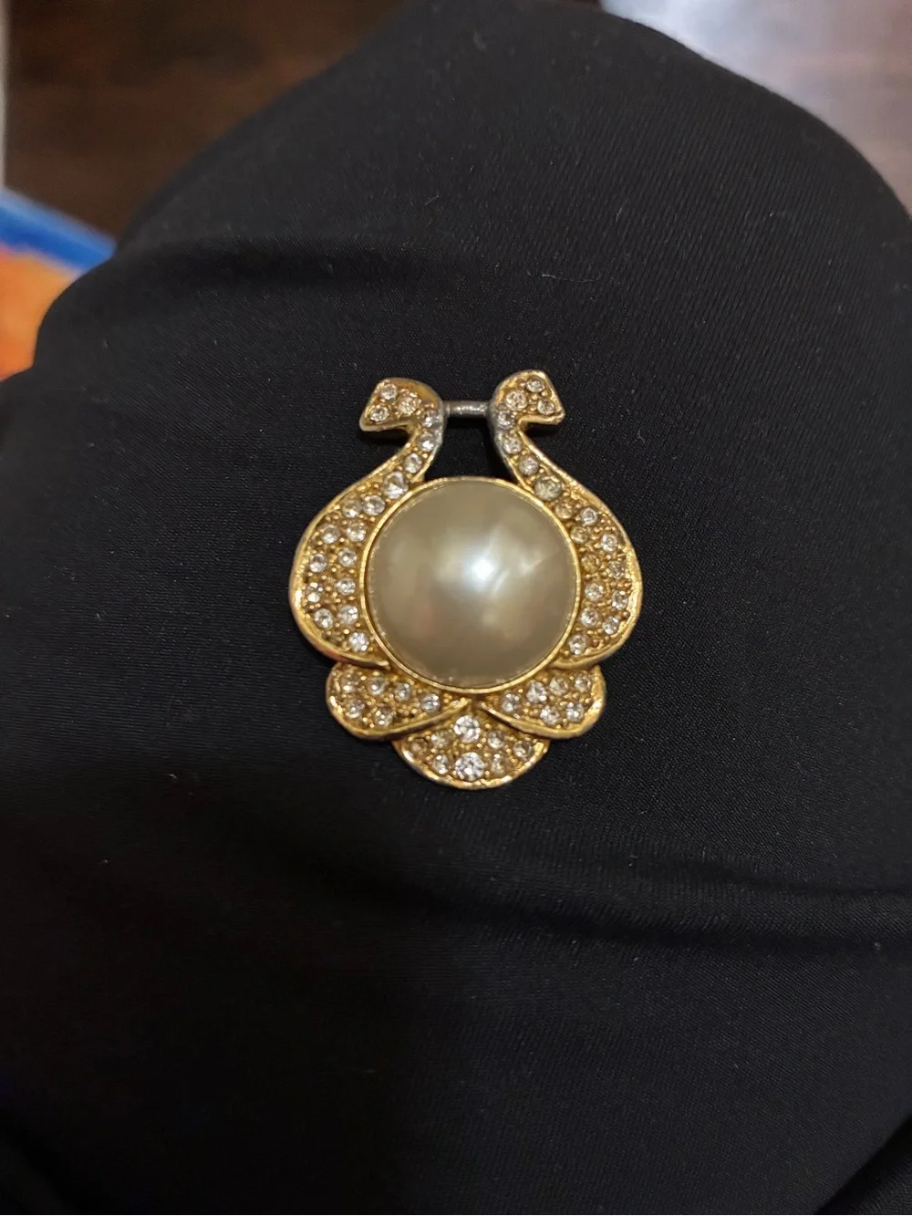 VINTAGE, Nolan Miller, Gold-Tone Faux Pearl Center pendant surrounded Crystals -